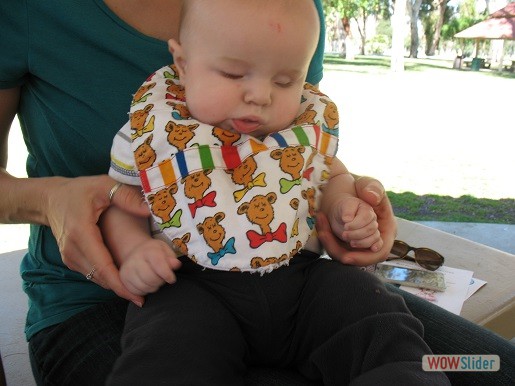 a baby is being held by his mother